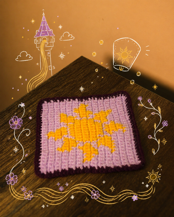 Handmade crochet wall square in lavender with a golden sun motif and deep plum border